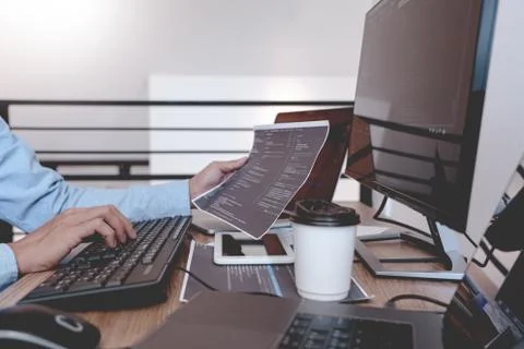 Programmer Typing Code on desktop computer, Developing programming and coding Foto stock