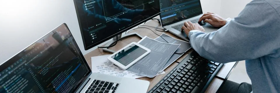 Programmer Typing Code on desktop computer, Developing programming and coding 库存照片