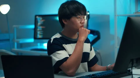 Programmer typing code dual screen backend logic software development technology Stock-Footage 313807615