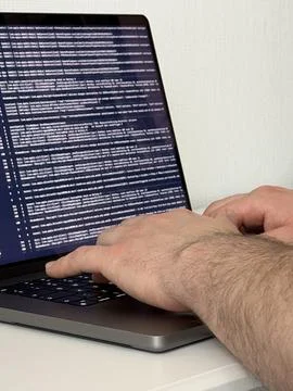 Programmer typing code on laptop, Close up angle Stock Photos