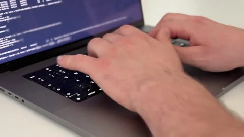 Programmer typing code on laptop Stock-Footage 336859491