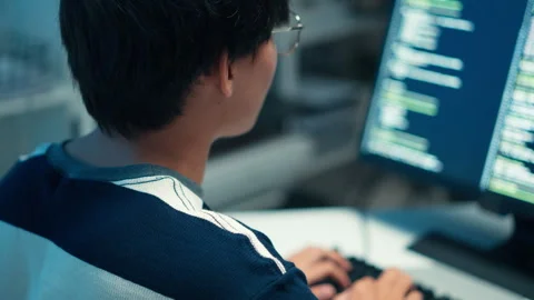 Programmer typing code monitor software engineer backend system task development Stock Footage 313807290