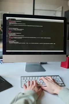 Programmer typing codes on computer Stockfoto's