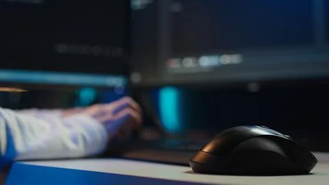 Programmer typing on computer to fix software vulnerabilities, close up 스톡 사진