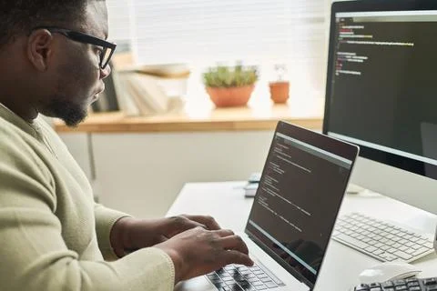 Programmer typing data code on laptop 写真素材