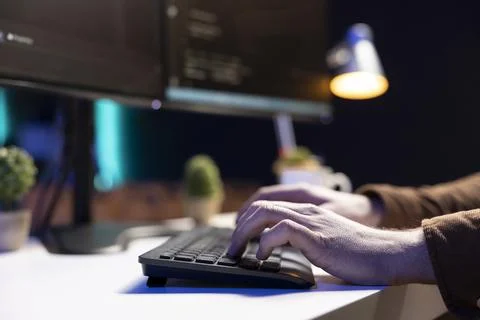 Programmer typing on keyboard, testing and debugging code, close up Stock Photos