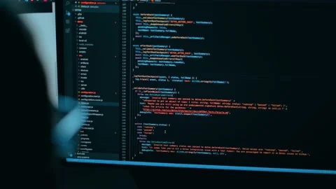 A programmer is typing new lines of HTML code. Laptop closeup. Working time. Web Stock Footage 141533234