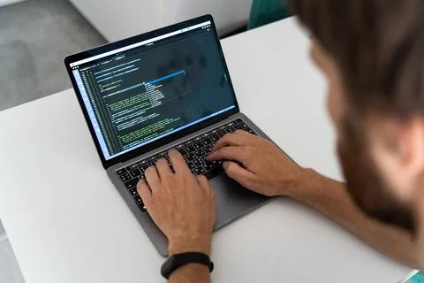 Programmer typing new lines of HTML Stock Photos