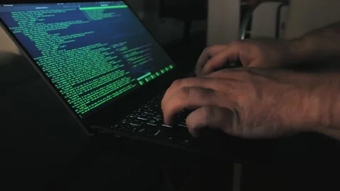 A programmer uses a laptop to enter computer code Stock Footage 205266376