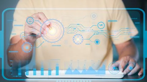A programmer uses a virtual hologram display, manipulating data with networ.. Stock Photos