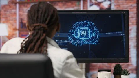 Programmer using computer at home for artificial intelligence computing 库存照片