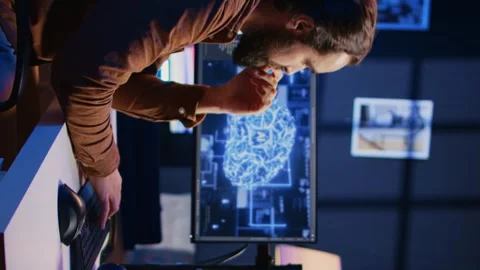 Programmer using computer to update AI neural networks, drinking coffee Stock Footage 265108087