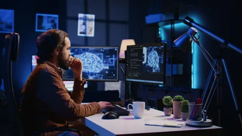 Programmer using computer to update AI neural networks, drinking coffee Stock Footage 265509372