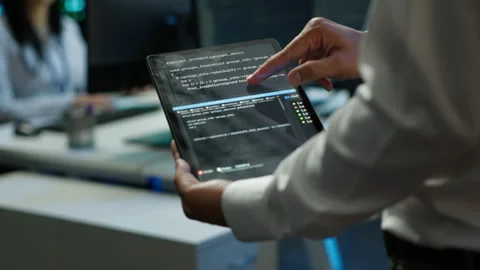 Programmer using device in data center, close up Stock Footage 280718002