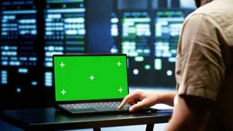 Programmer using green screen laptop 写真素材