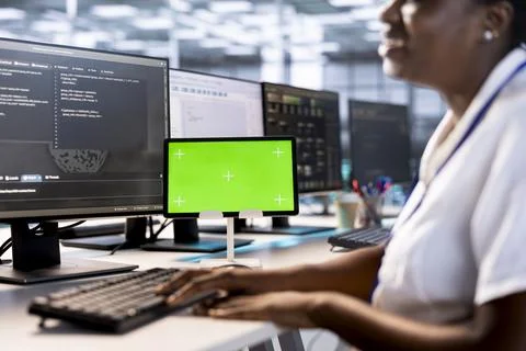 Programmer using green screen tablet in data center Stock-Fotos