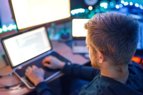 Programmer using laptop and PC, information coding Stock-Fotos