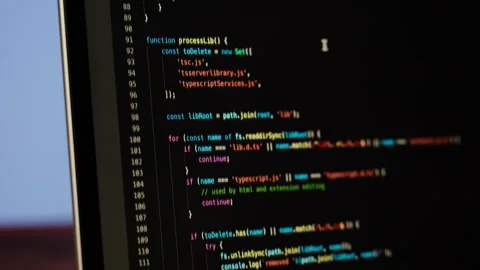 Programmer using laptop. Program code and script data on the screen close-up Video stock 192444316