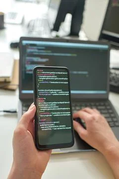 Programmer using smartphone to install software program 스톡 사진