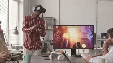 Programmer in VR Headset Playing Video Game with Controller Stock Footage 172192831
