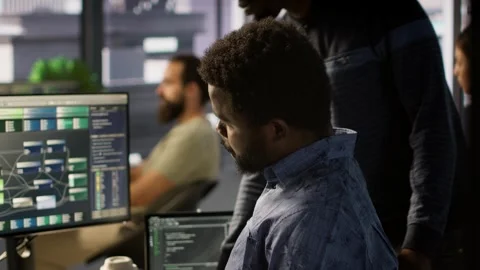 Programmer waiting for coworker to come help him fix applications issues Stock-Footage 318229040