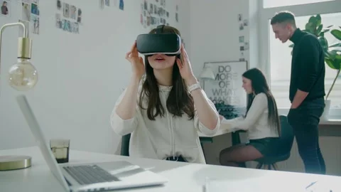 Programmer wearing virtual reality glasses tests software Stock Footage 156195252