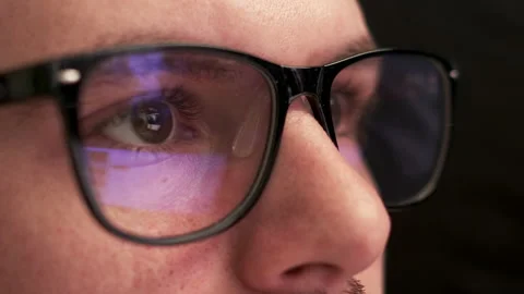 Programmer wears glasses working on computer at office Stock Footage 194393220