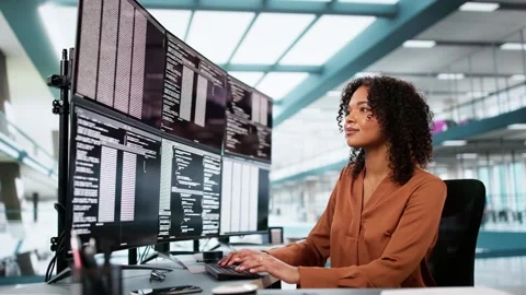 Programmer Woman Coding On Multiple Screens Stock Footage 304712688