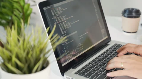Programmer woman writing program HTML code sitting at workplace in office Stock Footage 246566691