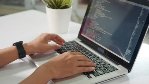 Programmer woman writing program HTML code sitting at workplace in office Stock Footage 248778370