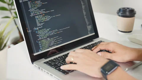 Programmer woman writing program HTML code sitting at workplace in office Stock Footage 251168332