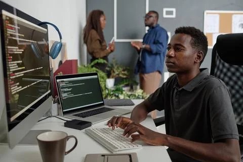 Programmer at Work in Modern Office Stock Photos