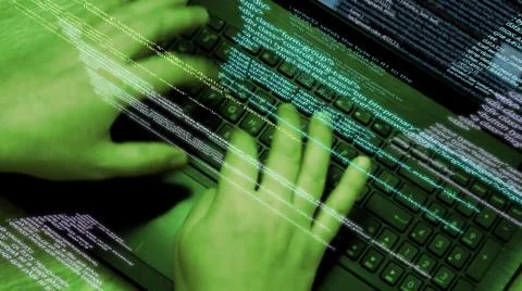 Programmer at work - software code running on screen and flying in the air. 库存照片