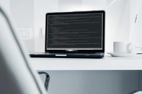 Programmer Work Station. White Clean Modern Office with Laptop Computer Stock Photos