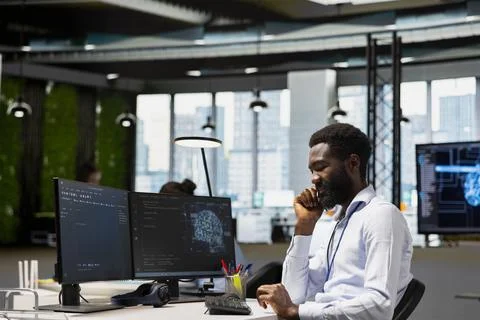 Programmer at work training machine learning models to monitor error logs Stock Photos