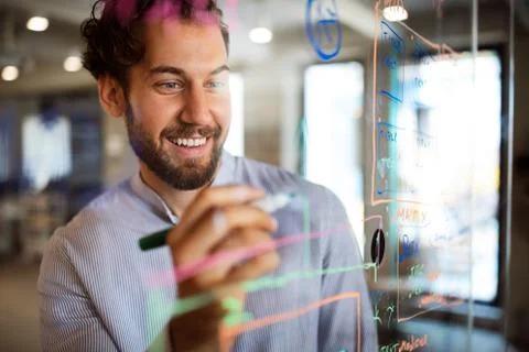 Programmer working and developing software in office Stock Photos