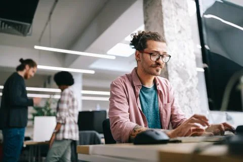 Programmer working and developing software in office Stock Photos