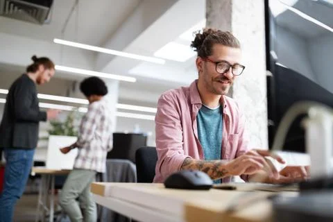 Programmer working and developing software in office Stock Photos
