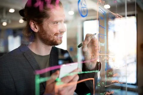 Programmer working and developing software in office Stock Photos