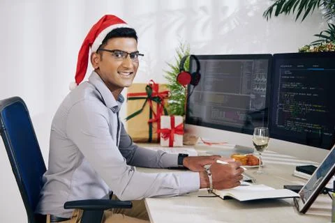 Programmer working on Christmas Foto stock