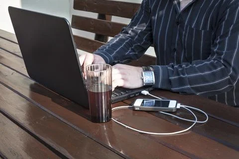 Programmer working on a code outdoors Stock Photos