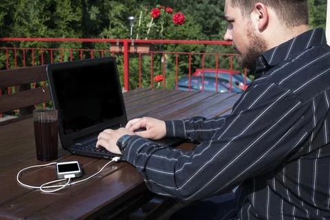 Programmer working on a code outdoors Stock Photos