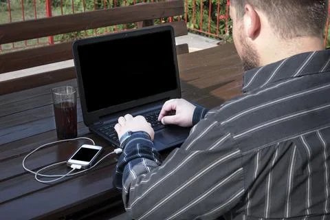 Programmer working on a code outdoors Stock Photos