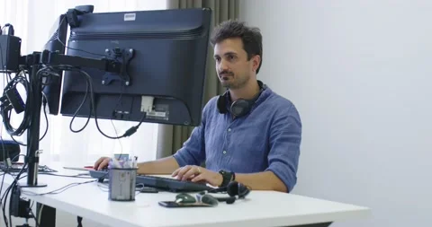 Programmer working on computer in IT office typing data coding in software Stock Footage 147650897