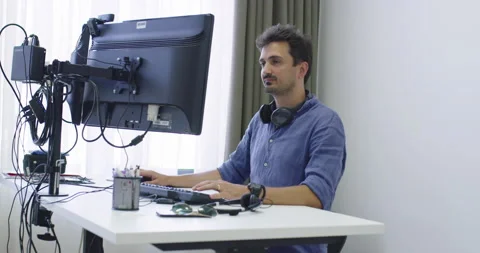 Programmer working on computer in IT office typing data Stock Footage 151468710