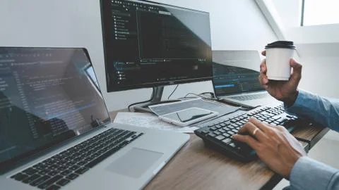 Programmer working On Computer In IT Office Typing Data Coding in software an 스톡 사진