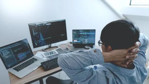 Programmer working On Computer In IT Office Typing Data Coding in software an 写真素材