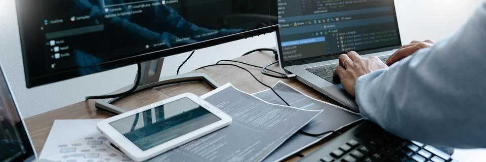 Programmer working On Computer In IT Office Typing Data Coding in software an 스톡 사진