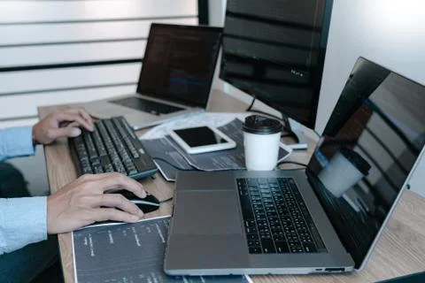 Programmer working On Computer In IT Office Typing Data Coding in software an Stock Photos