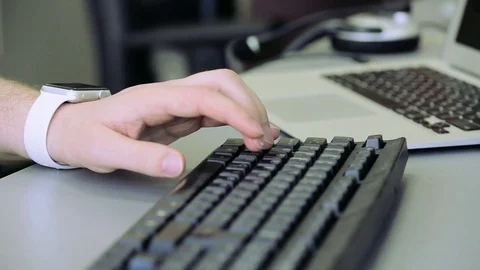 Programmer working on the computer keyboard Black Stock Footage 75316421